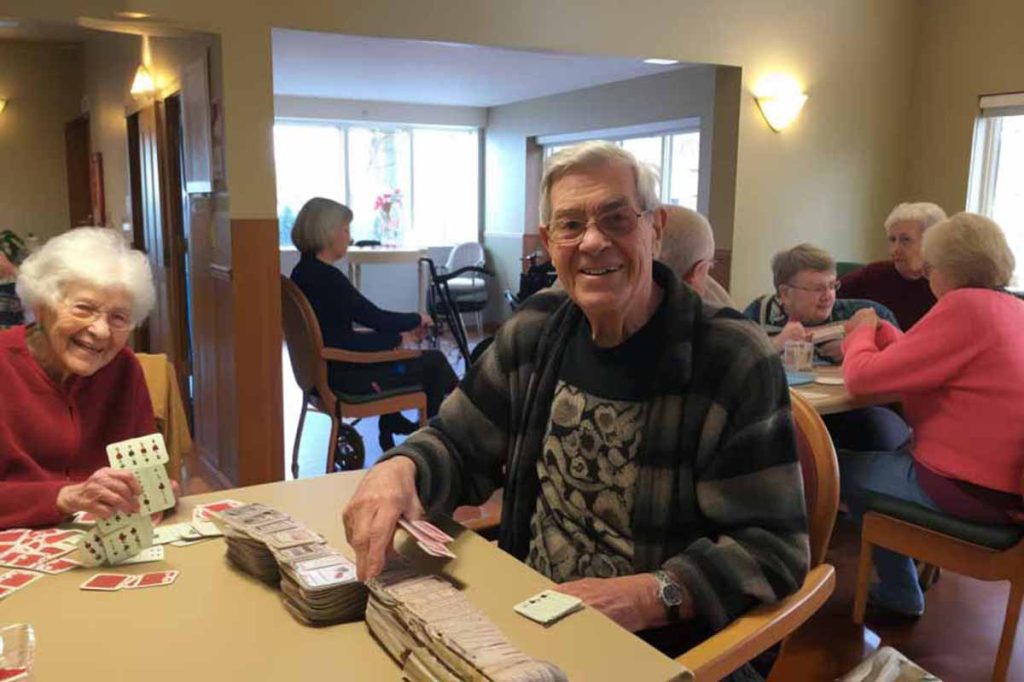 A cheerful male senior does volunteer work in a nursing home